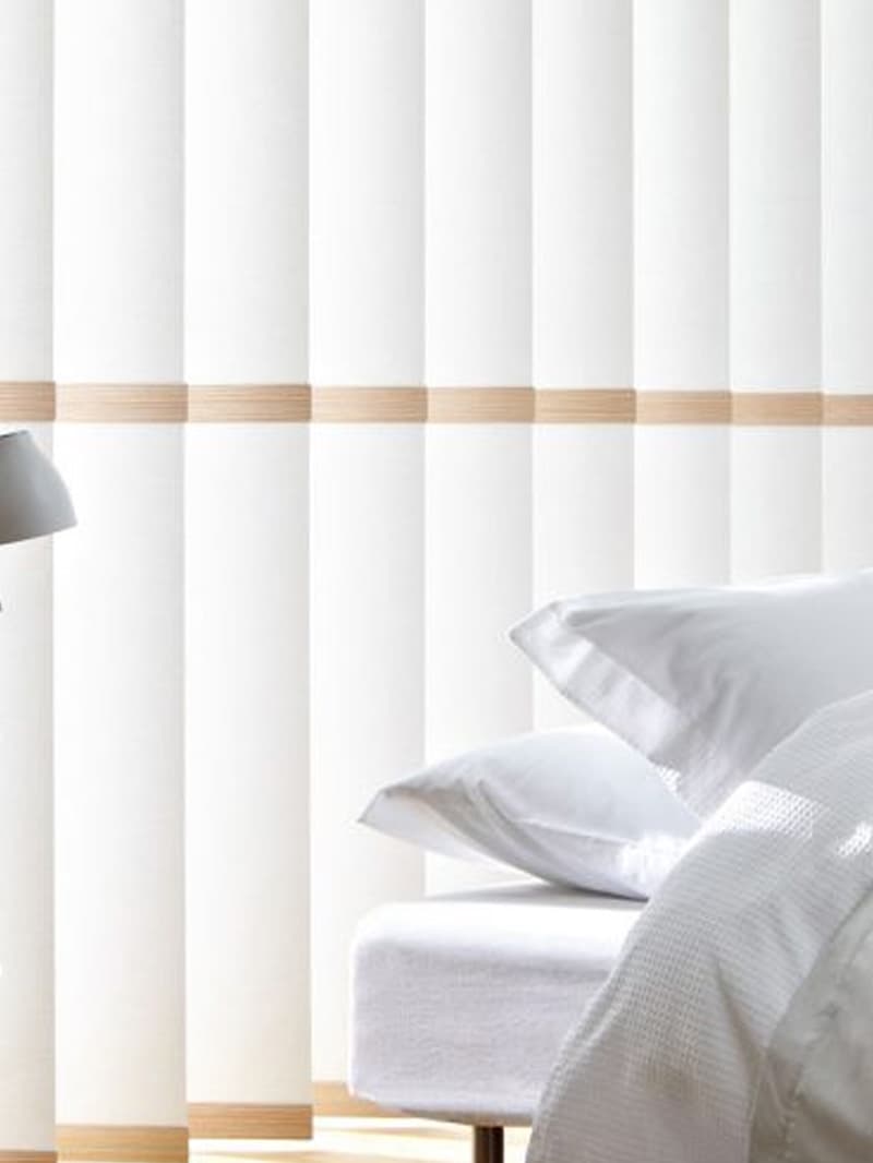 Vertical Blinds Warrington Widnes Runcorn | Poppy Blinds White vertical blinds installed in modern bedroom providing light control in a Warrington home